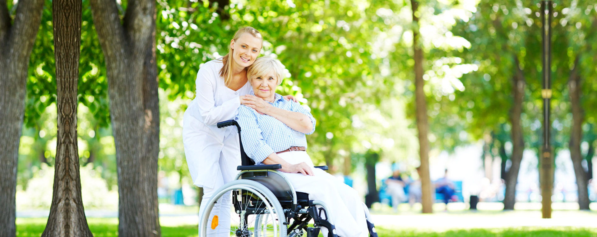 Smiling caregiver and elderly woman