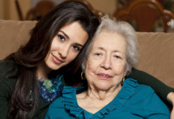 Smiling caregiver and elderly woman