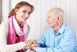 Caregiver caring an elderly man
