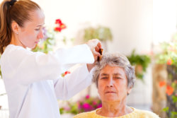 Caregiver caring an elderly woman